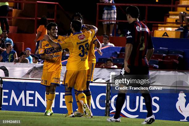 Damian Alvarez and Emanuel Villa of Tigres celebrates a goal during a match between Atlante and Tigres as part of the Torneo Clausura 2013 at Andres...