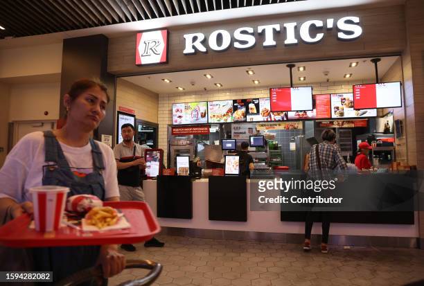 People purchase meals in the Rostic's Cafe on August 12, 2023 in Saint Petersburg, Russia. In the first half of 2023 000 foreign tourists visited...