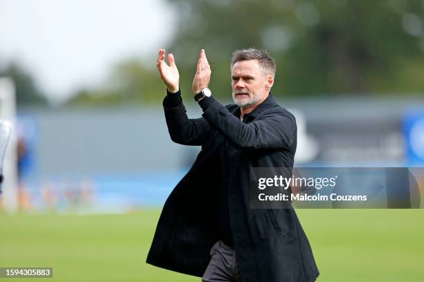 Dons Head Coach Graham Alexander celebrates following the Sky Bet League Two match between Wrexham and Milton Keynes Dons at Stok Cae Ras stadium on...