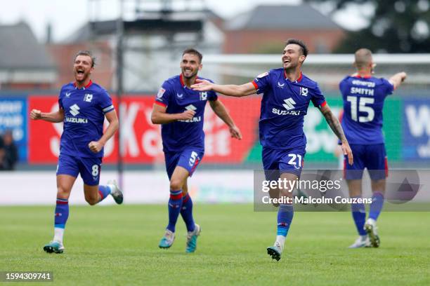 Daniel Harvie of MK Dons celebrates scoring a goal during the Sky Bet League Two match between Wrexham and Milton Keynes Dons at Stok Cae Ras stadium...