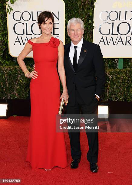 Actress Carey Lowell and actor Richard Gere arrive at the 70th Annual Golden Globe Awards held at The Beverly Hilton Hotel on January 13, 2013 in...