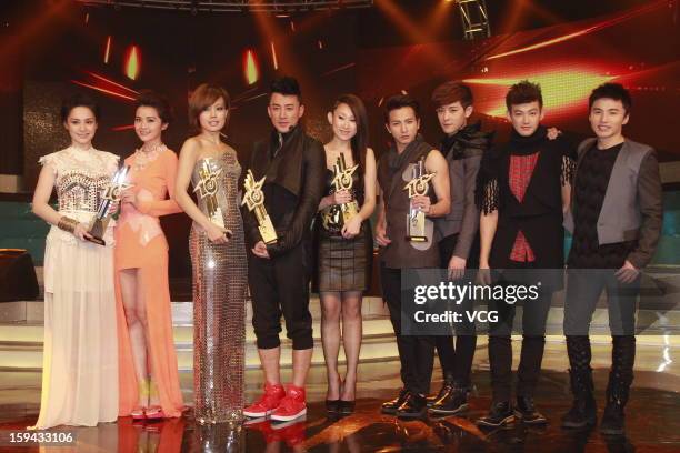 Singers Gillian Chung and Charlene Choi of Twins, Joey Yung, Raymond Lam, Ivana Wong and Taiwanese boy band Lollipop F attend the 2012 Jade Solid...