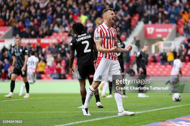Ben Wilmot of Stoke City celebrates after Jacob Brown of Stoke City scores their sides fourth goal during the Sky Bet Championship match between...