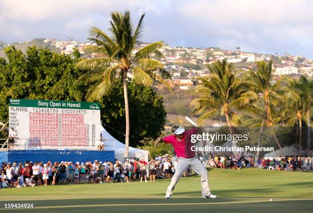 Russell Henley celebrates after making a birdie putt on the 18th hole green to win the Sony Open in Hawaii following the final round at Waialae...