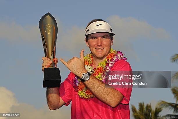 Russell Henley poses with the tournament trophy after winning the Sony Open in Hawaii at Waialae Country Club on January 13, 2013 in Honolulu, Hawaii.