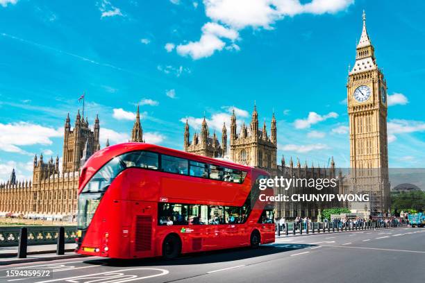 london big ben and traffic on westminster bridge - london landmarks stock pictures, royalty-free photos & images
