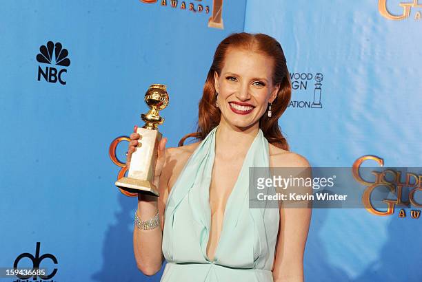 Actress Jessica Chastain, winner of Best Actress in a Motion Picture for "Zero Dark Thirty," poses in the press room during the 70th Annual Golden...
