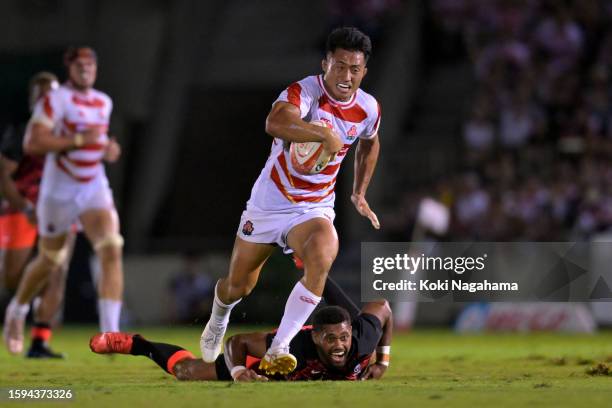 Tomoki Osada of Japan in action against Ilaisa Droasese of Fiji during the international test between Japan and Fiji at Prince Chichibu Memorial...