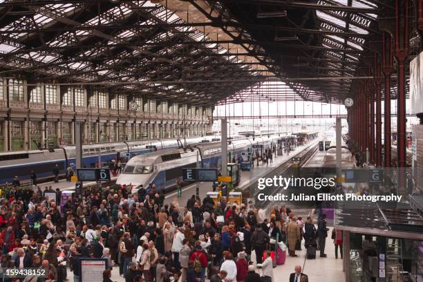 crowds of people in gare de lyon. - crowded train stock pictures, royalty-free photos & images