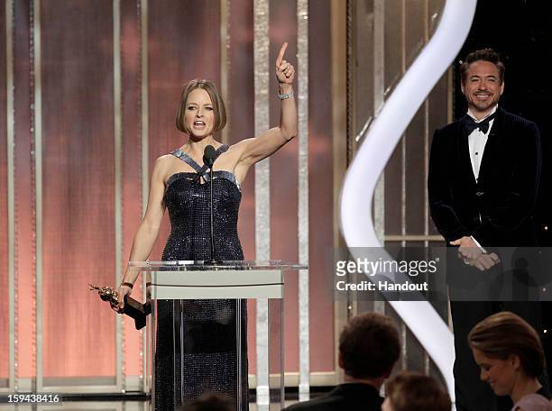 In this handout photo provided by NBCUniversal, Actress Jodie Foster receives the Cecil B. Demille Award from Robert Downey Jr. On stage during the...
