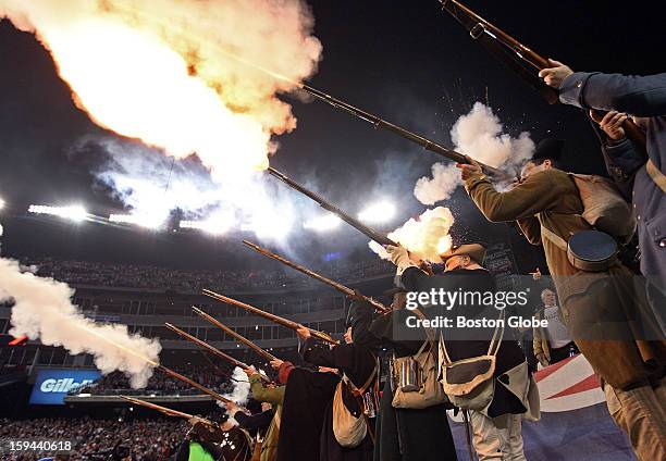 Members of the "End Zone Militia" fire their muskets yet again following another Patriots touchdown as the New England Patriots hosted the Houston...