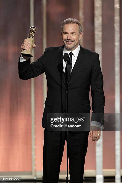In this handout photo provided by NBCUniversal, Actor Kevin Costner accepts the Best Actor award for Mini-Series or TV Movie, "Hatfields & McCoys" on...