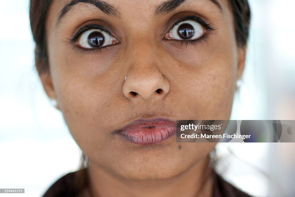 Indian girl looking straight at camera, funny face