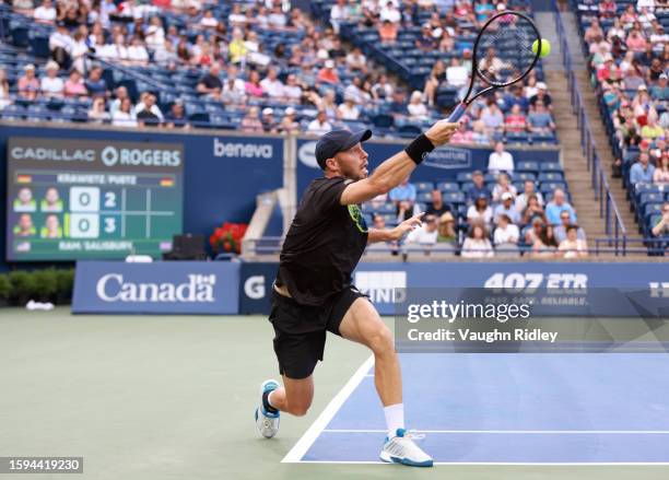 Tim Puetz of Germany hits a shot against Rajeev Ram of the United States and Joe Salisbury of Great Britain during Day Six of the National Bank Open,...