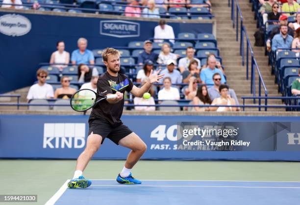 Kevin Krawietz of Germany hits a shot against Rajeev Ram of the United States and Joe Salisbury of Great Britain during Day Six of the National Bank...