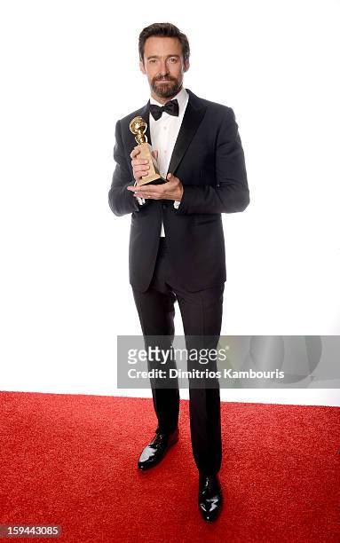 Actor Hugh Jackman, winner of the Best Performance by an Actor in a Motion Picture - Comedy Or Musical Award for "Les Miserables" poses for a...