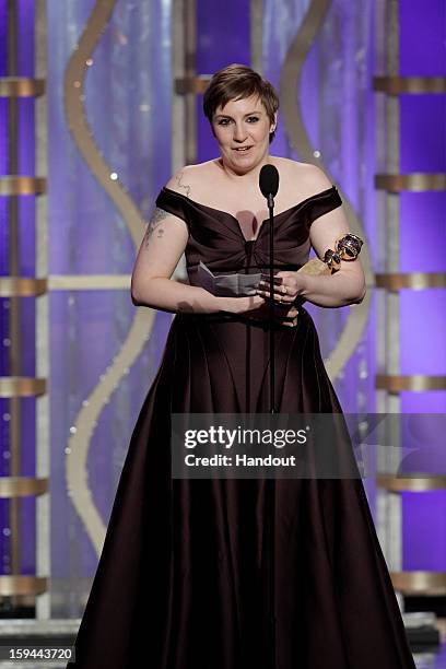 In this handout photo provided by NBCUniversal, Actress Lena Dunham accepts the Best Actress award for TV Series, Comedy or Musical, "Girls" on stage...