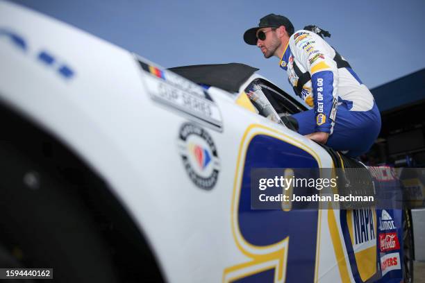 Chase Elliott, driver of the NAPA Auto Parts Chevrolet, enters his car during practice for the NASCAR Cup Series FireKeepers Casino 400 at Michigan...