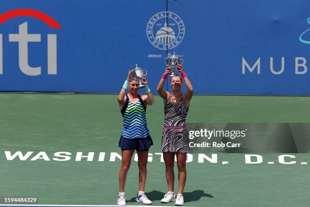 Vera Zvonareva and Laura Siegemund of Germany pose with the trophy after defeating Alexa Guarachi of Chile and Monica Niculescu of Romania during the...