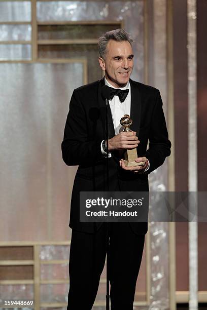 In this handout photo provided by NBCUniversal, Actor Daniel Day Lewis accepts the Best Actor award for Motion Picture, Drama, "Lincoln" on stage...