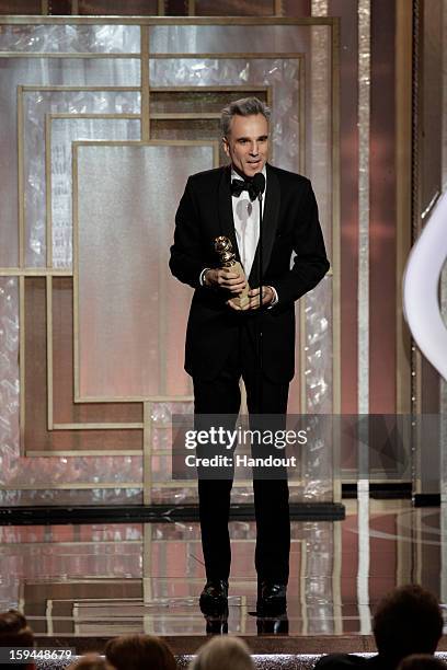 In this handout photo provided by NBCUniversal, Actor Daniel Day Lewis accepts the Best Actor award for Motion Picture, Drama, "Lincoln" on stage...