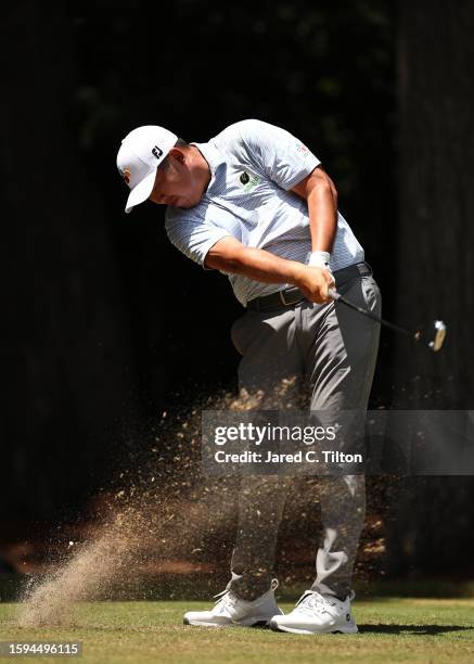 Byeong Hun An of South Korea plays his shot from the second tee during the third round of the Wyndham Championship at Sedgefield Country Club on...