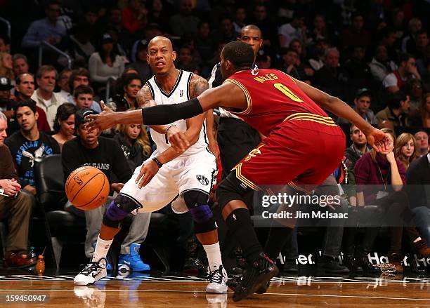 Keith Bogans of the Brooklyn Nets in action against C.J. Miles of the Cleveland Cavaliers at Barclays Center on December 29, 2012 in the Brooklyn...