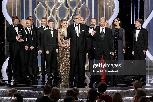 In this handout photo provided by NBCUniversal, Alex Gansa, Executive Producer accepts the Best TV Series, Drama award for "Homeland" on stage during...