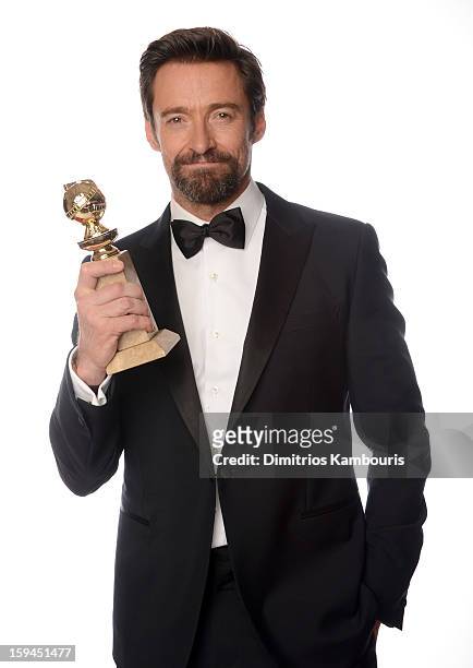 Actor Hugh Jackman, winner of the "Best Performance by an Actor in a Motion Picture - Comedy Or Musical Award for "Les Miserables" poses for a...