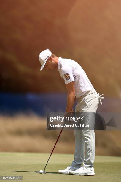 Adam Svensson of Canada putts on the first green during the third round of the Wyndham Championship at Sedgefield Country Club on August 05, 2023 in...