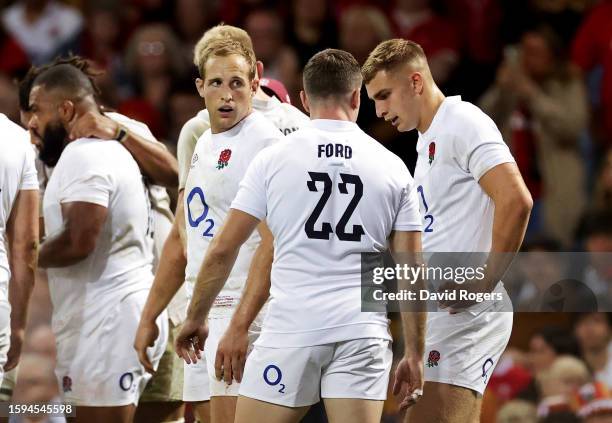 Max Malins looks dejected as they speak with George Ford and Jack van Poortvliet of England during the Summer International match between Wales and...