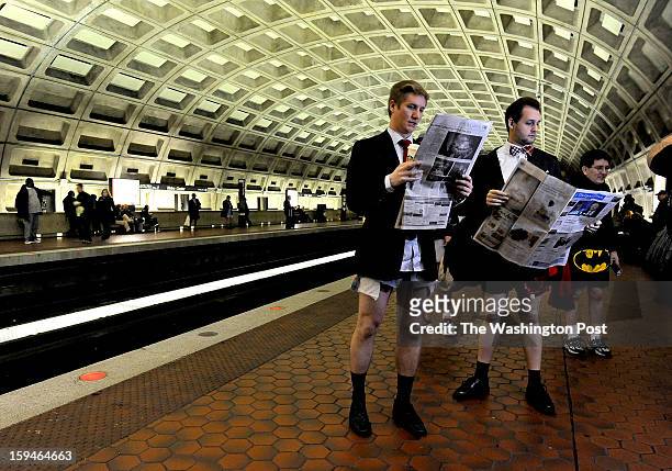 Colin VanDercreek and Jesse Helfrich read their paper as is it's a normal work day heading to the office. They were participants in the annual No...