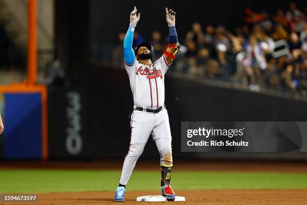 Marcell Ozuna of the Atlanta Braves gestures after he hit a two-run double against the New York Mets during the eighth inning in game two of a...