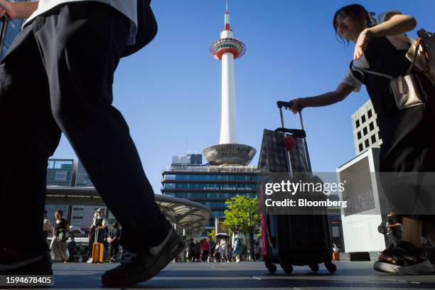 Visitors outside the Kyoto station in Kyoto, Japan, on Friday, Aug. 11, 2023. Japan is scheduled to release its second-quarter gross domestic product...