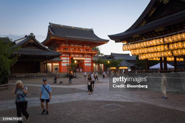 Tourists visit Yasaka shrine in Kyoto, Japan, on Friday, Aug. 11, 2023. Japan is scheduled to release its second-quarter gross domestic product...