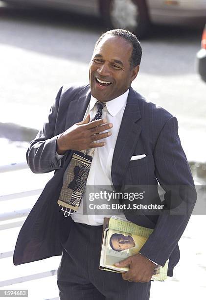 Former NFL Star and actor O.J. Simpson arrives at Miami-Dade County courthouse for his "road rage" trial October 22, 2001 in Miami, FL. U.S. Federal...