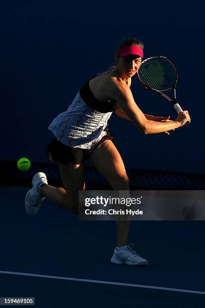 Mona Barthel of Germany plays a backhand in his first round match against Ksenia Pervak of Kazakhstan during day one of the 2013 Australian Open at...