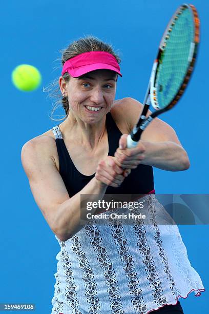 Mona Barthel of Germany plays a backhand in his first round match against Ksenia Pervak of Kazakhstan during day one of the 2013 Australian Open at...