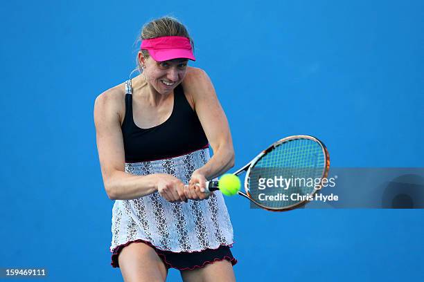 Mona Barthel of Germany plays a backhand in his first round match against Ksenia Pervak of Kazakhstan during day one of the 2013 Australian Open at...