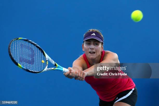 Ksenia Pervak of Kazakhstan plays a backhand in her first round match against Mona Barthel of Germany during day one of the 2013 Australian Open at...