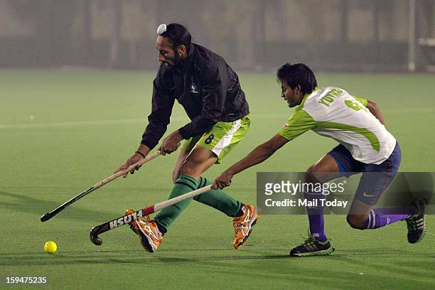 Delhi Waverriders captain Sardar Singh and Yuvraj Walmiki during a practice session ahead of Hockey India League at National Stadium in New Delhi on...