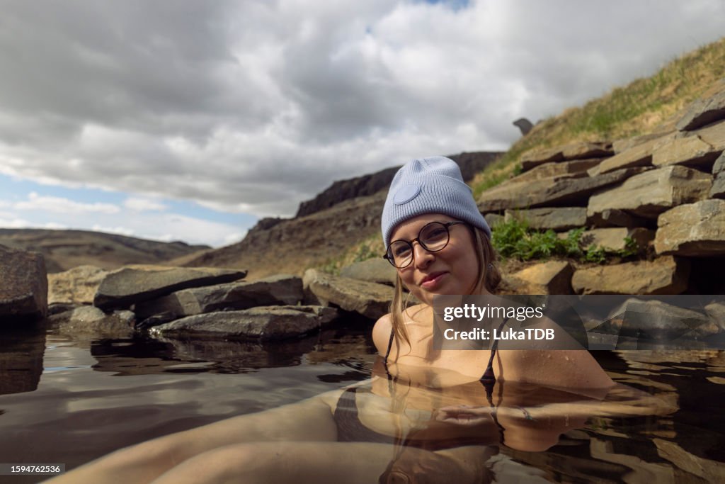 Portrait of a beautiful woman enjoying a hot spring