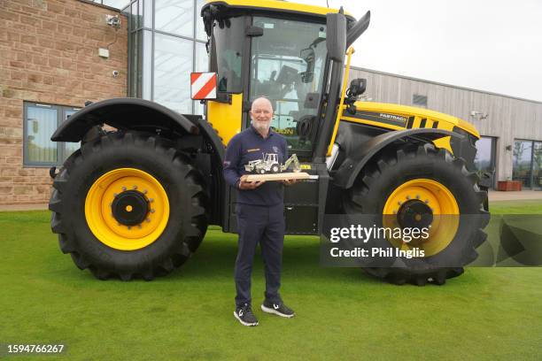 Peter Baker of England poses with the trophy during Day Three of the JCB Championship 2023 at JCB Golf & Country Club on August 05, 2023 in...
