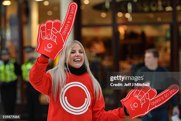 Staff from Glasgow 2014 help with the opening of volunteer applications on January 14, 2013 in Glasgow, Scotland. Up to 15,000 people will be needed...