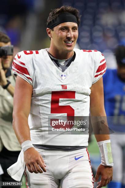 New York Giants quarterback Tommy DeVito walks off the field after the conclusion of the NFL preseason football game opener against the Detroit Lions...