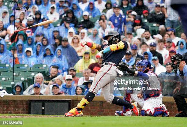 Ronald Acuna Jr. #13 of the Atlanta Braves loses his bat during the third inning of a game against the Chicago Cubs at Wrigley Field on August 05,...