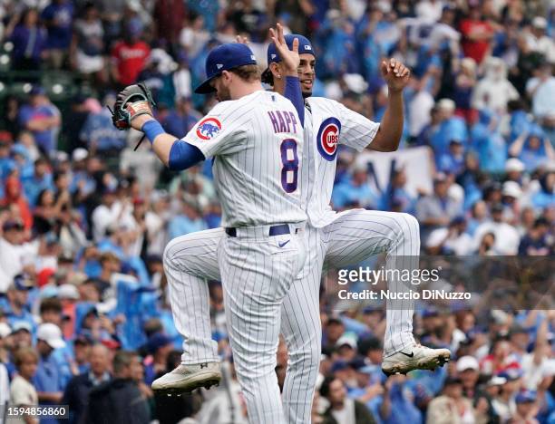 Ian Happ of the Chicago Cubs celebrates with Christopher Morel of the Chicago Cubs at the end of their team win over the Atlanta Braves at Wrigley...