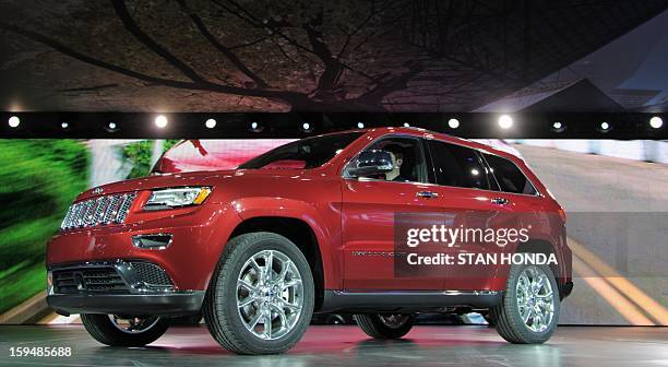 The 2013 Jeep Grand Cherokee is introduced at the 2013 North American International Auto Show in Detroit, Michigan, January 14, 2013. AFP PHOTO/Stan...