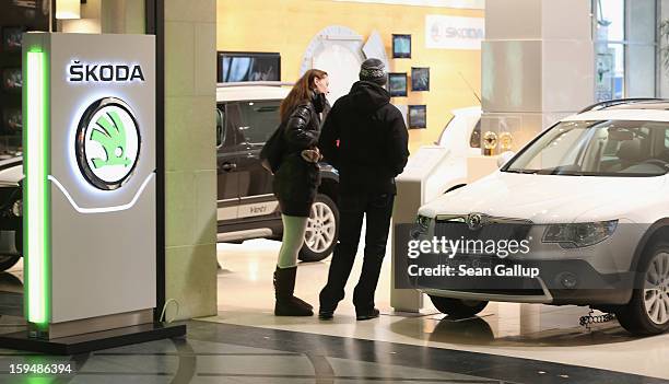 Visitors look at Skoda cars at a Volkswagen Group showroom on January 14, 2013 in Berlin, Germany. Volkswagen Group, which includes the VW, Audi,...