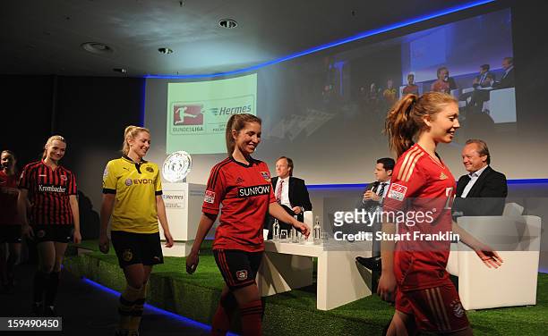 Girls wear the football kits of the 36 clubs in the first and second Bundesliga during the press conference to announce Hermes as the new DFL premium...